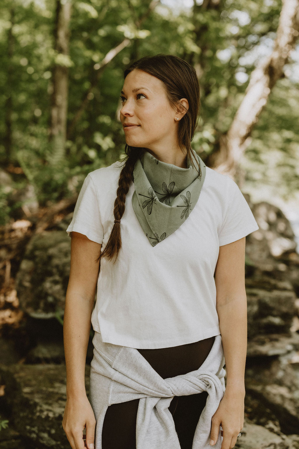 green dragonfly bandana on woman by riverside