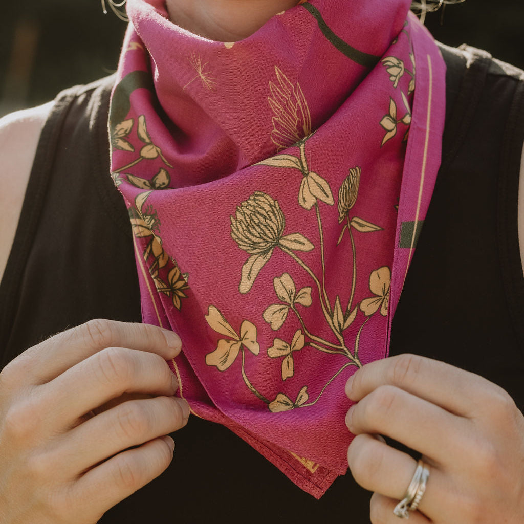 woman showing her pink and yellow clover bandana