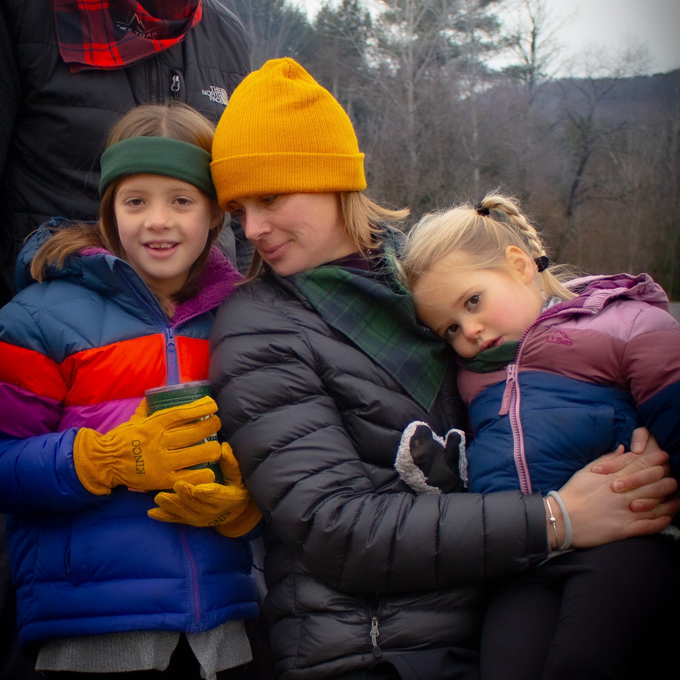 mom and kids at ascutney outdoors wearing bandanas, winter gear and matching outfits